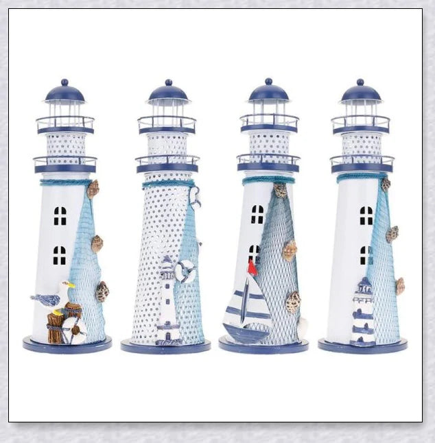 Oceanica LED Lighthouse Lantern Nightlight with nautical details like a small boat, life buoy, and seashells, providing a soft warm glow.