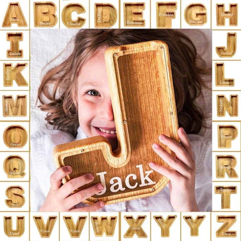 Personalized letter-shaped wooden money bank with clear viewing window for tracking savings progress