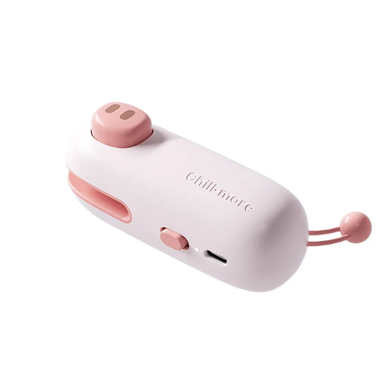 A compact, rechargeable bag sealer with a unique cartoon design, perfect for preserving food freshness at home or on the go.