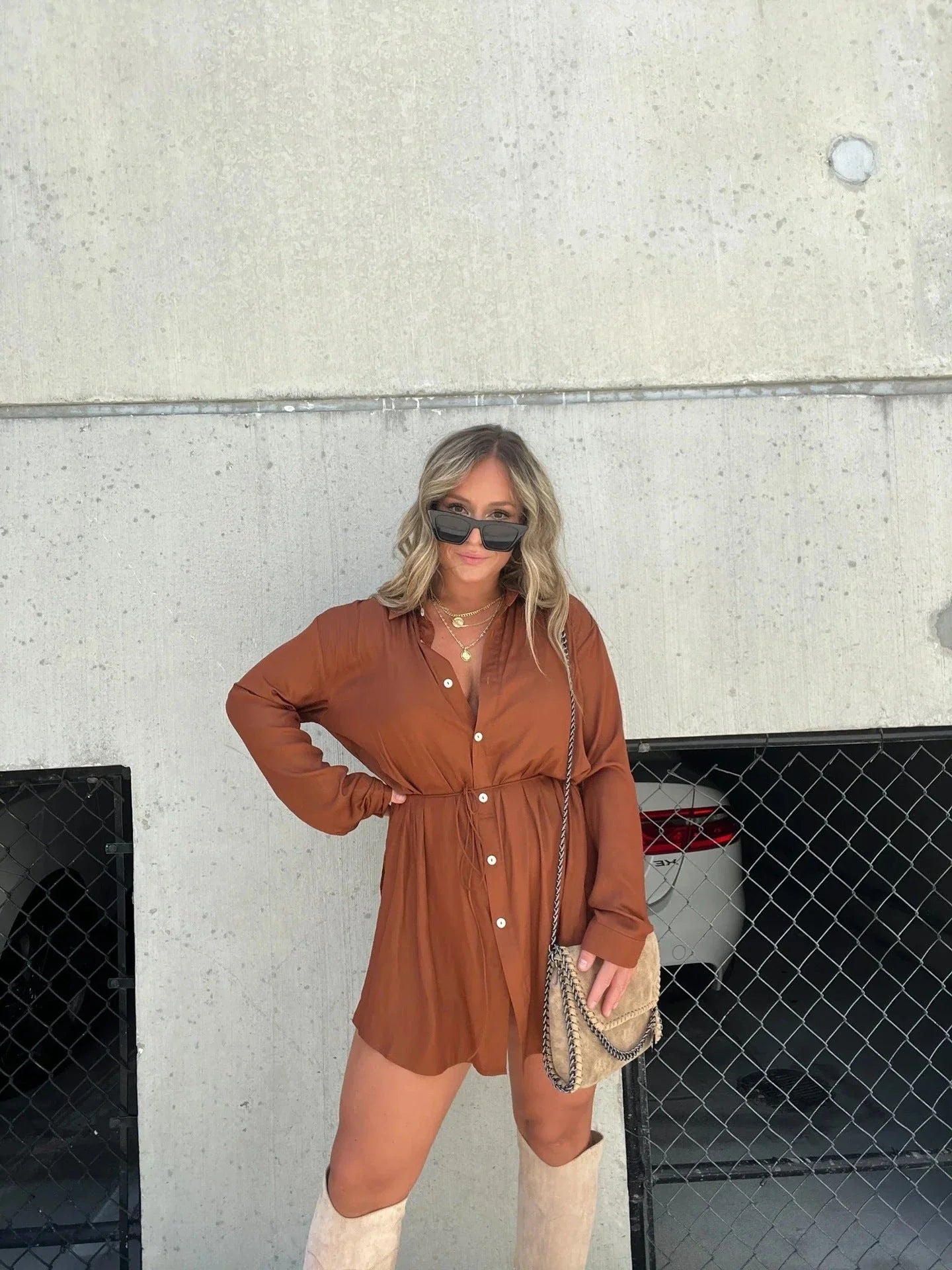Women's long sleeve jumpsuit with button accents in various vibrant colors