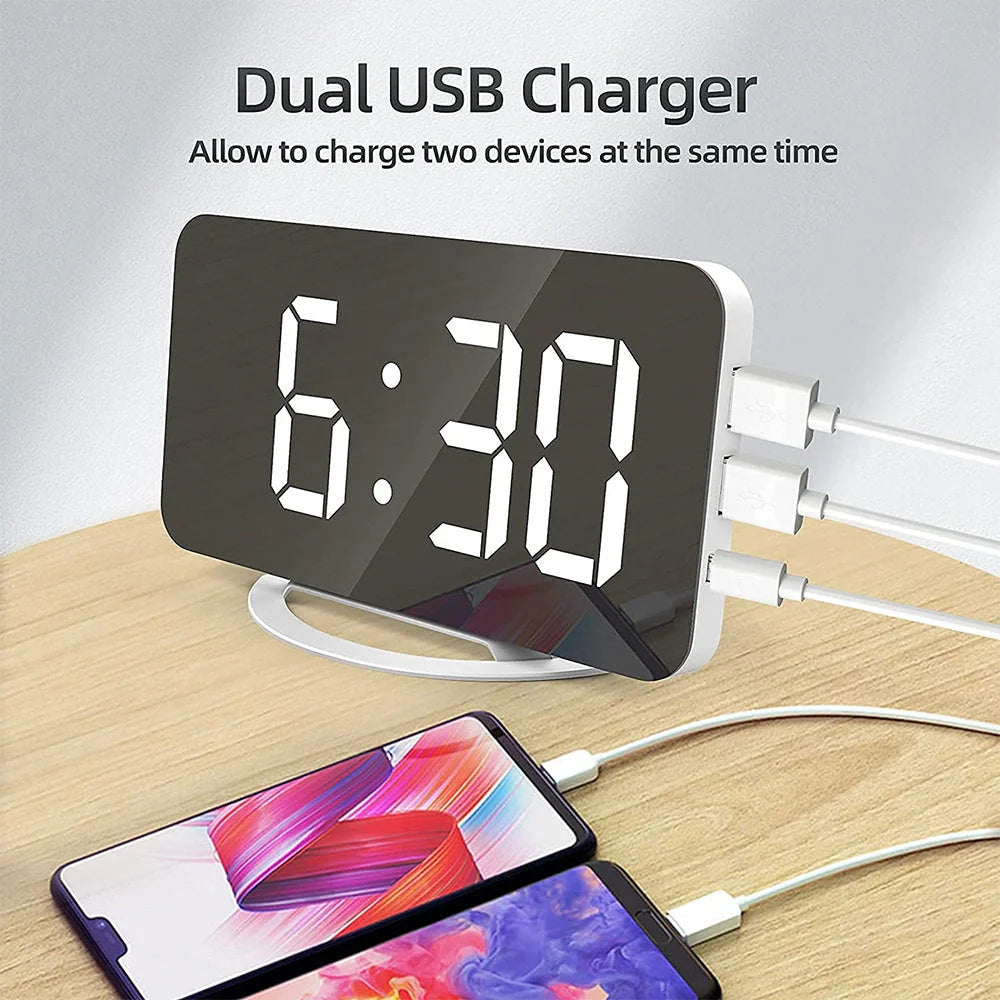 Digital mirror clock with LED display and dual USB ports on a desk