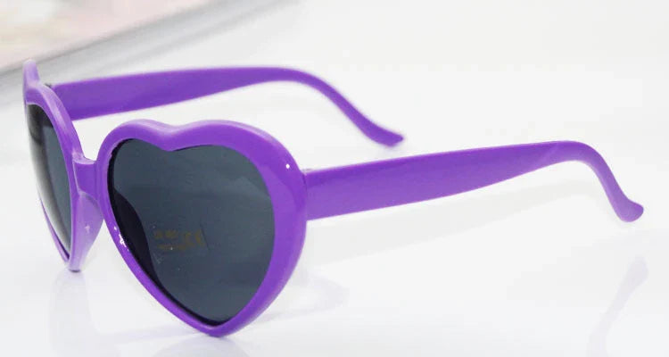 Stylish heart-shaped sunglasses with unique lens design that transforms light into enchanting special effects