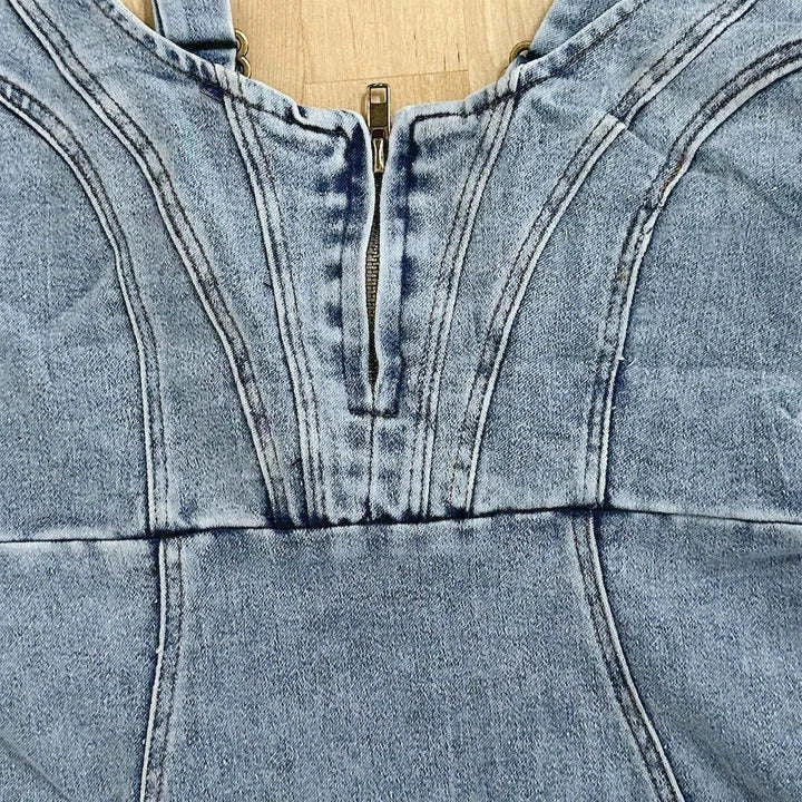 Chic denim dress with modern U-neck design, adjustable straps, and slit detail for a flattering, versatile look