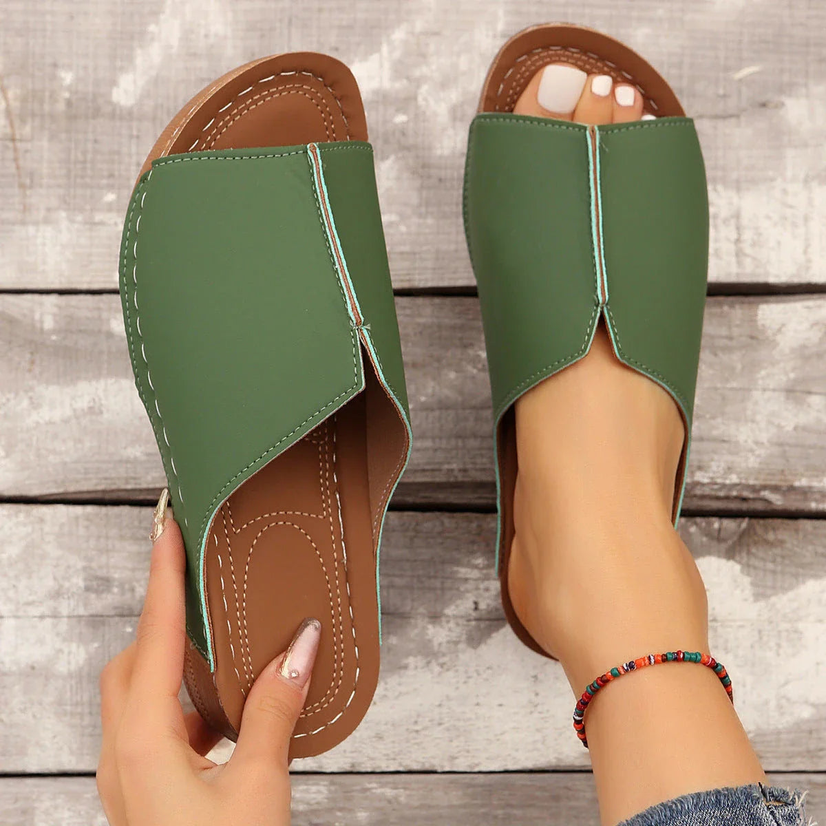 Fashionable wedge sandals in a variety of colors, featuring a peep-toe design and thick, durable soles for comfort and style