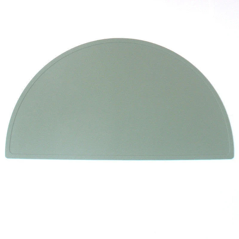 Durable silicone placemat in various colors, featuring waterproof and stain-resistant properties for easy cleaning