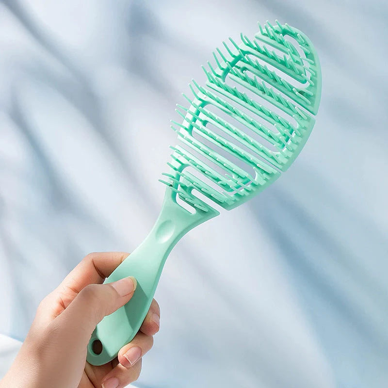 Stylish Massage Comb in various colours offering a soothing scalp massage and modern, minimalist design