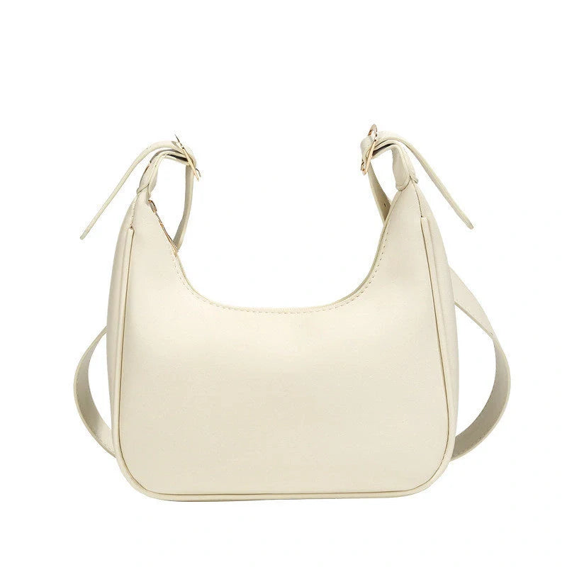 Stylish women's PU leather dumpling crossbody bag in black and white