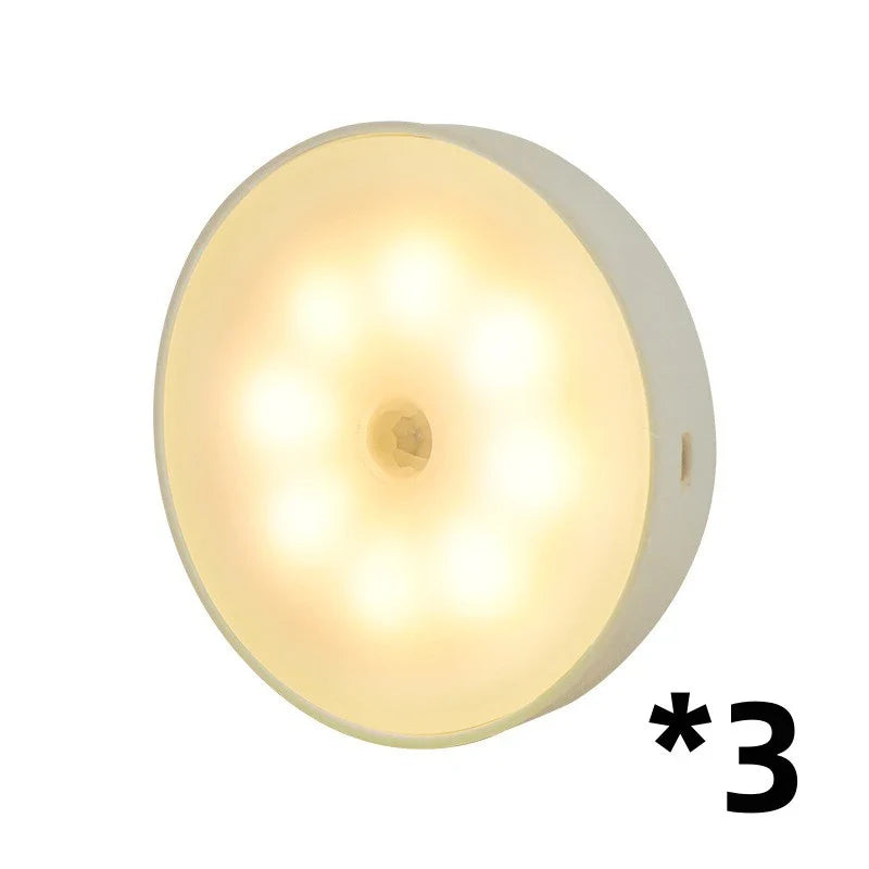 Motion-activated LED puck lights in warm and white color options, with various pack sizes and USB recharging