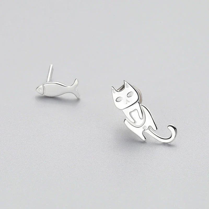 Elegant asymmetric 925 sterling silver stud earrings with cat and fish motifs, a modern and sophisticated accessory