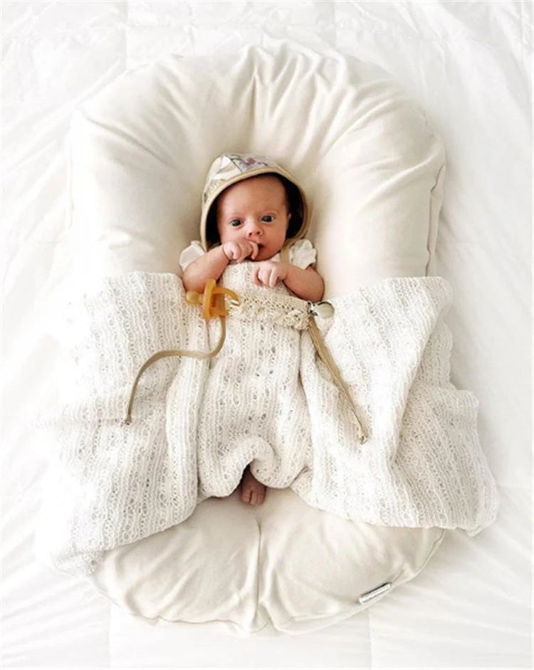 Portable baby nest crib with cotton cover for newborns, dimensions 75cm by 45cm