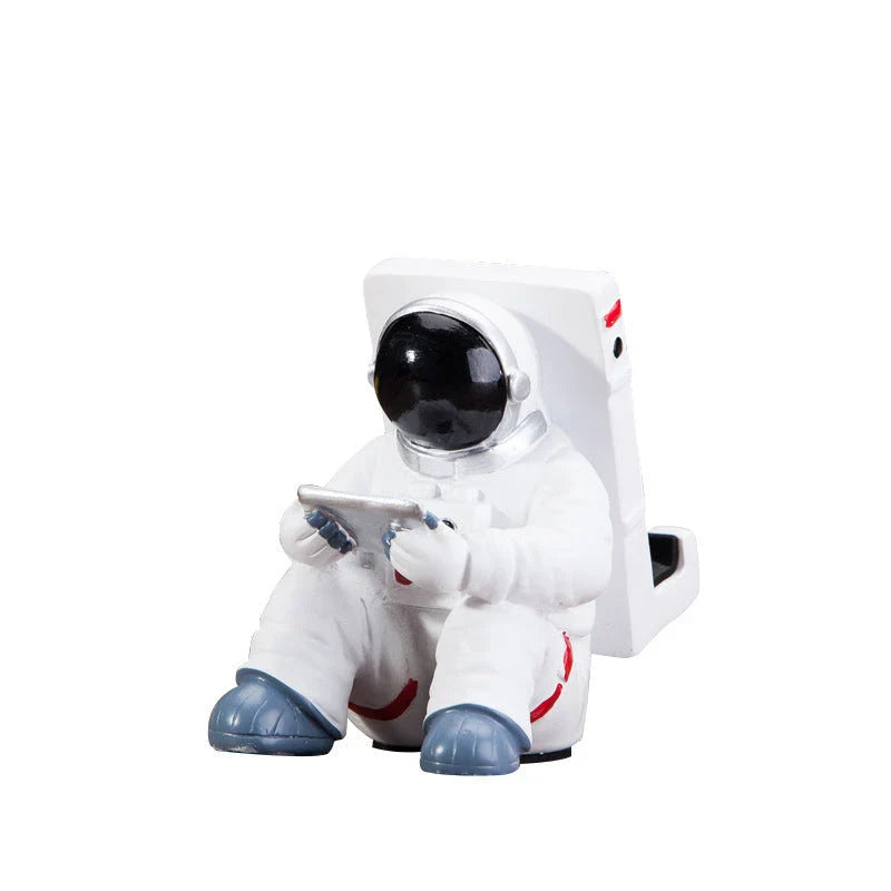 Charming astronaut-themed mobile phone stand made of high-quality resin, designed to securely hold your phone on your desk or workspace