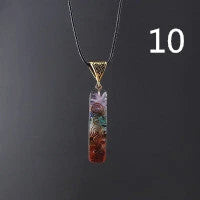 A stunning chakra crystal pendant with natural patterns and organic imperfections, showcasing the beauty of nature.