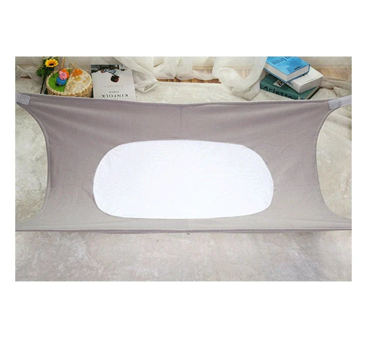 Portable baby crib hammock made of soft crushed velour in various colors to help reduce SIDS and flat head syndrome