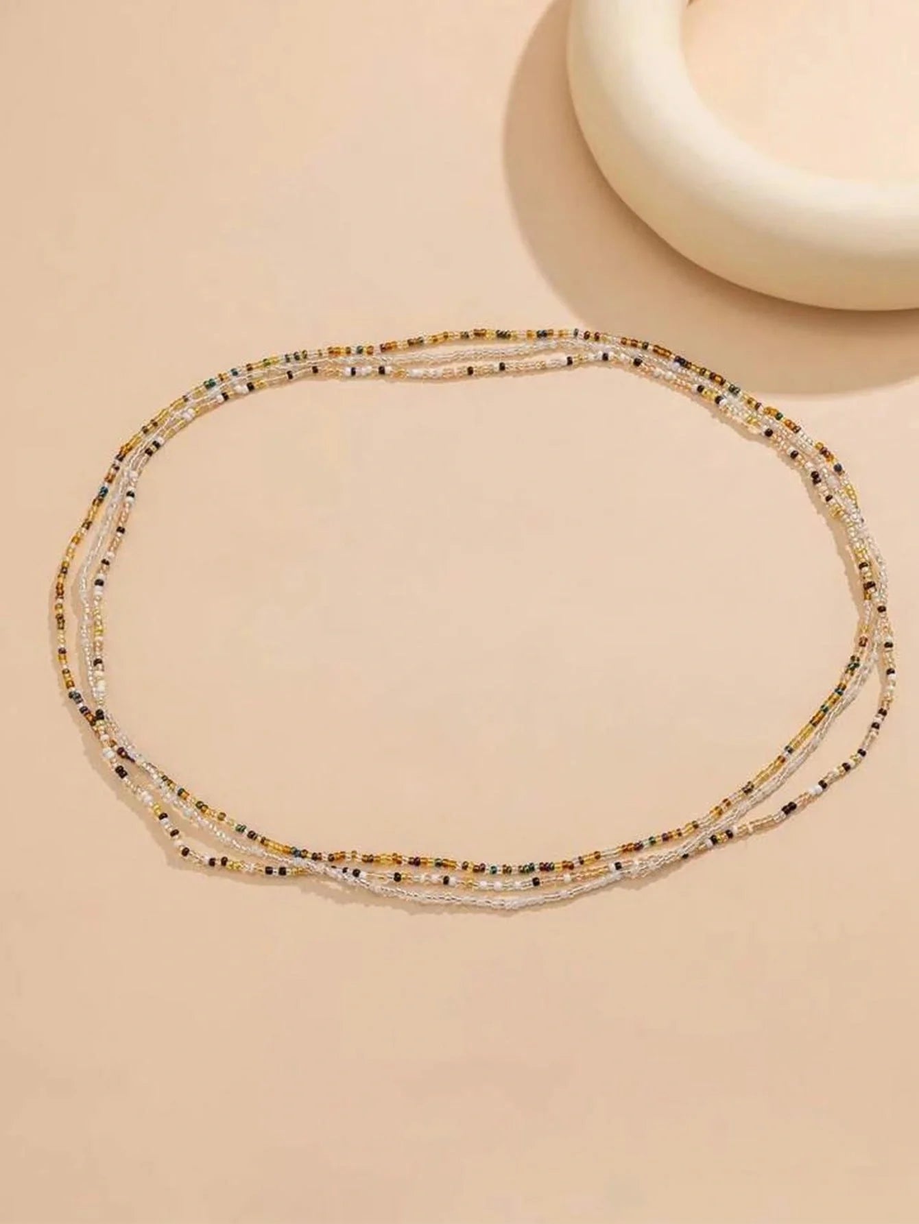 Stylish mixed colour beaded waist chain accessory for beach vacations and holidays