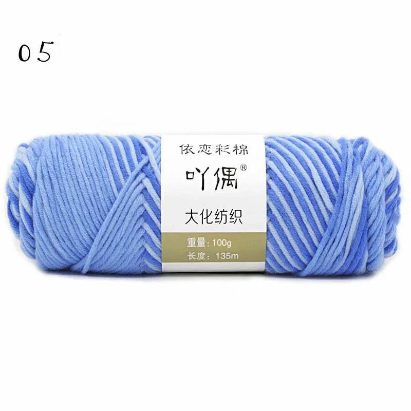 Luxurious gradient milk cotton yarn balls in a variety of vibrant colours, perfect for knitting, weaving, and other textile crafts.