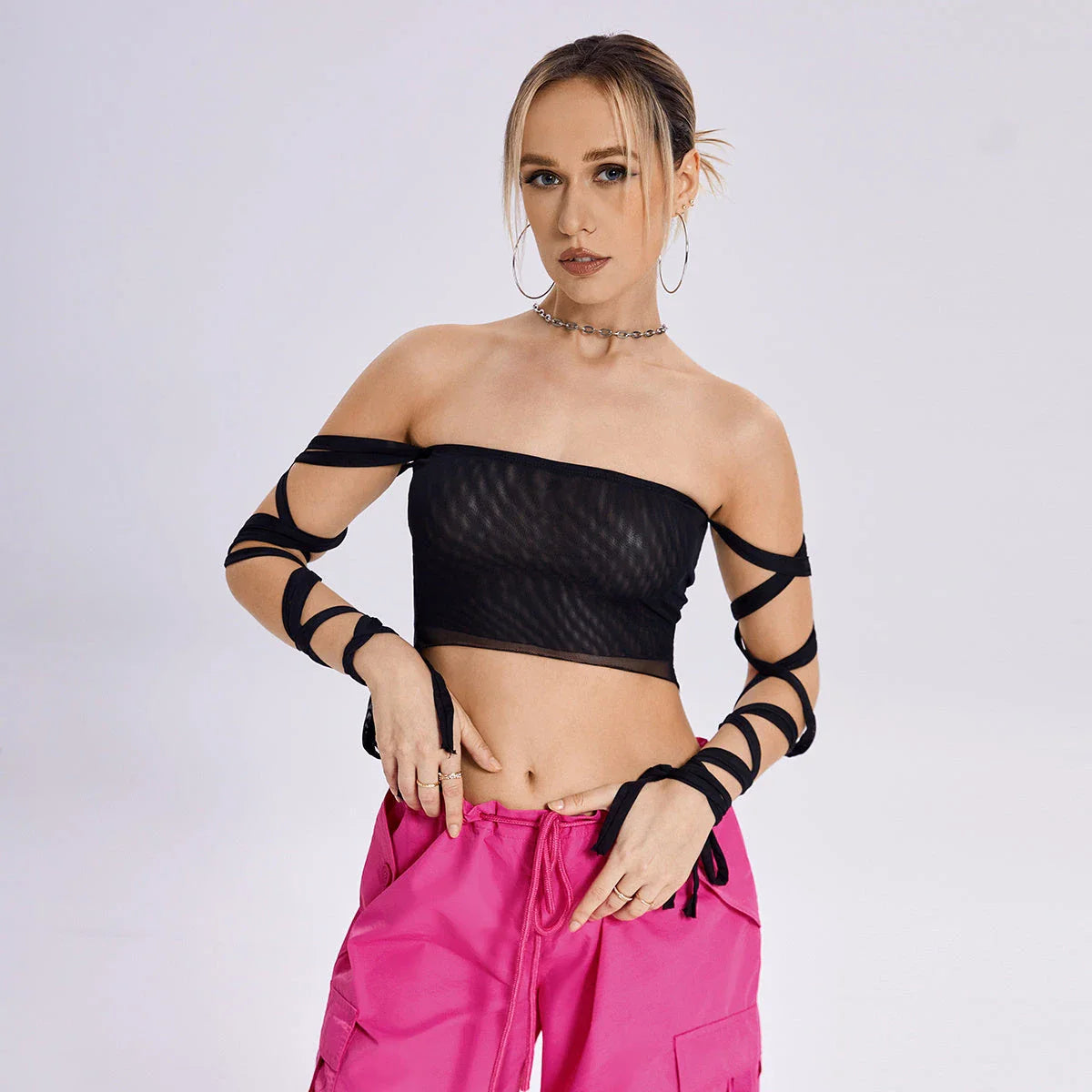 Stylish women's tank top with elastic cross-arm straps, available in black color