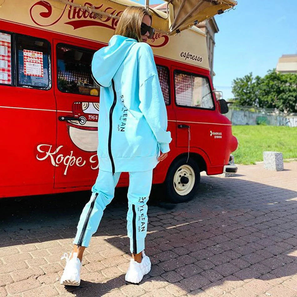A stylish long hoodie jumpsuit in a variety of sophisticated colours, featuring a flattering silhouette and premium materials for all-day comfort.