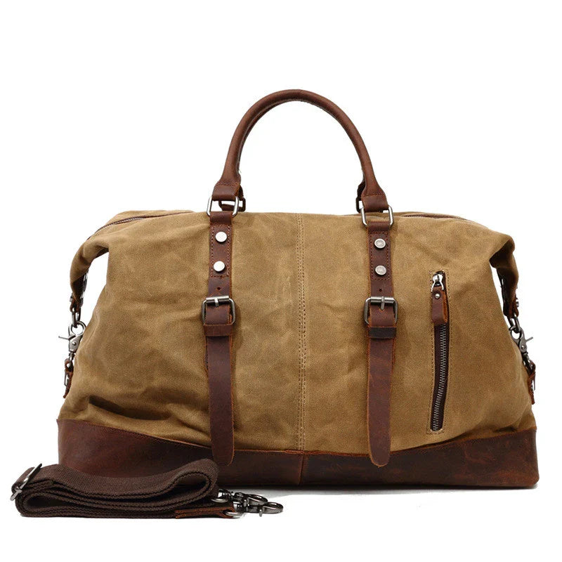 A large, khaki-coloured canvas crossbody luggage bag with multiple pockets and compartments for organised travel
