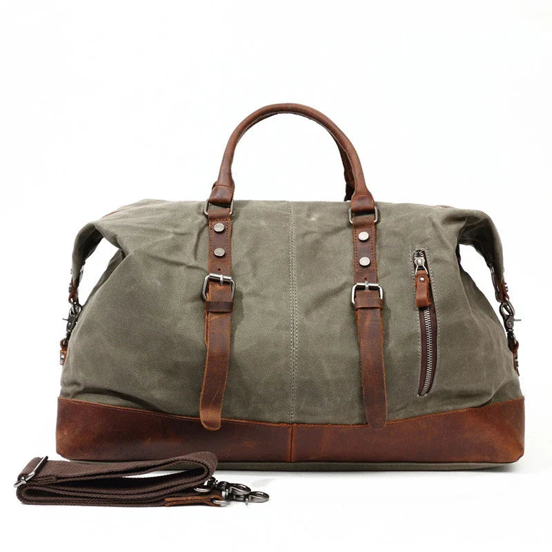 A large, khaki-coloured canvas crossbody luggage bag with multiple pockets and compartments for organised travel