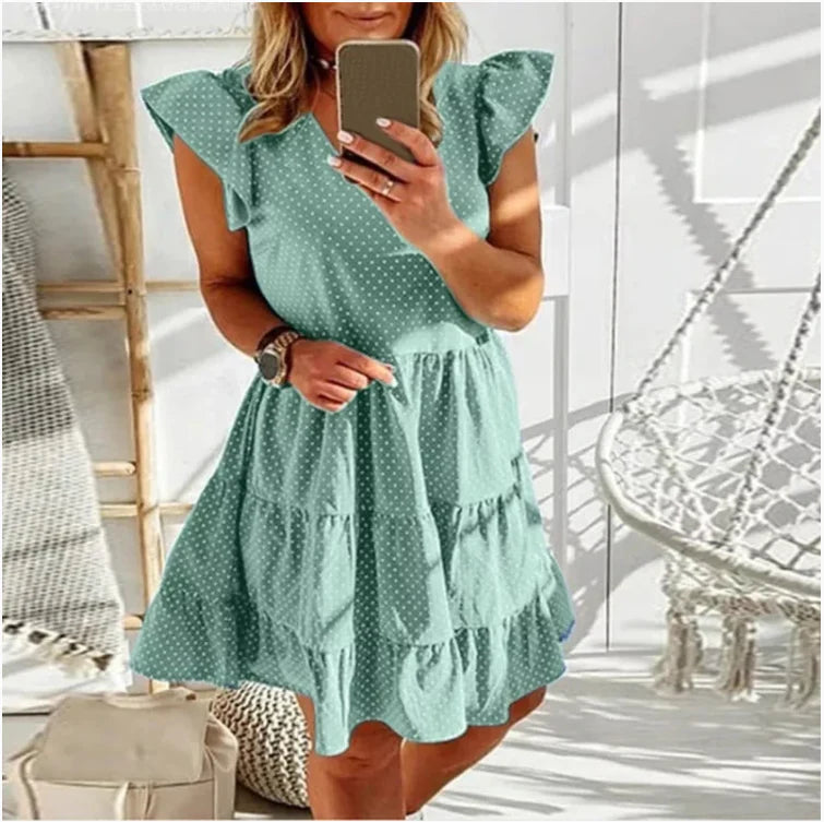 Elegant digital print v-neck ruffled dress in blue, featuring a cascading ruffle design and premium polyester fibre material.
