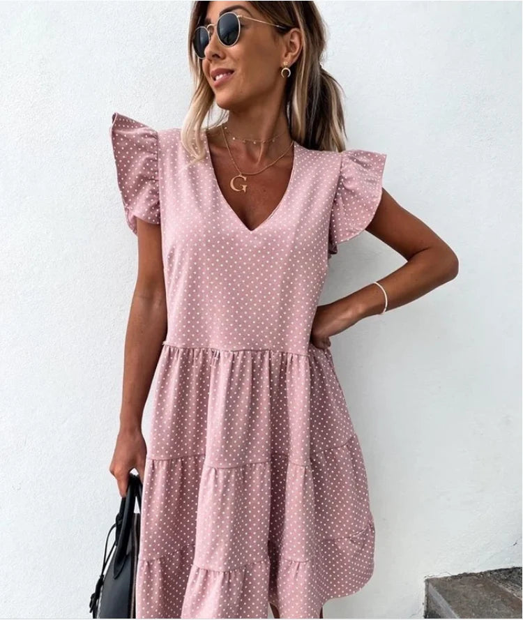 Elegant digital print v-neck ruffled dress in blue, featuring a cascading ruffle design and premium polyester fibre material.