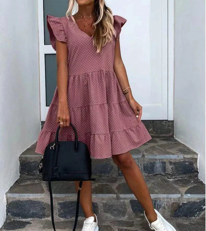 Elegant digital print v-neck ruffled dress in blue, featuring a cascading ruffle design and premium polyester fibre material.