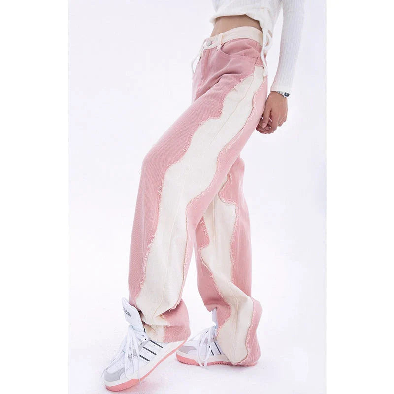 Model wearing high-waisted, wide-leg pink denim jeans with a stylish and comfortable fit