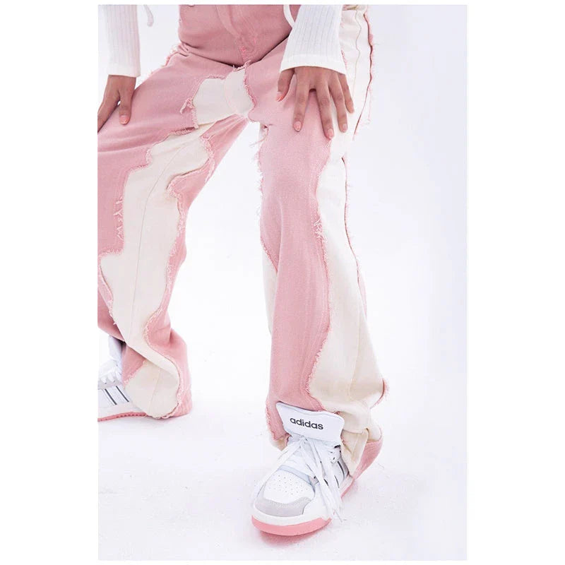 Model wearing high-waisted, wide-leg pink denim jeans with a stylish and comfortable fit