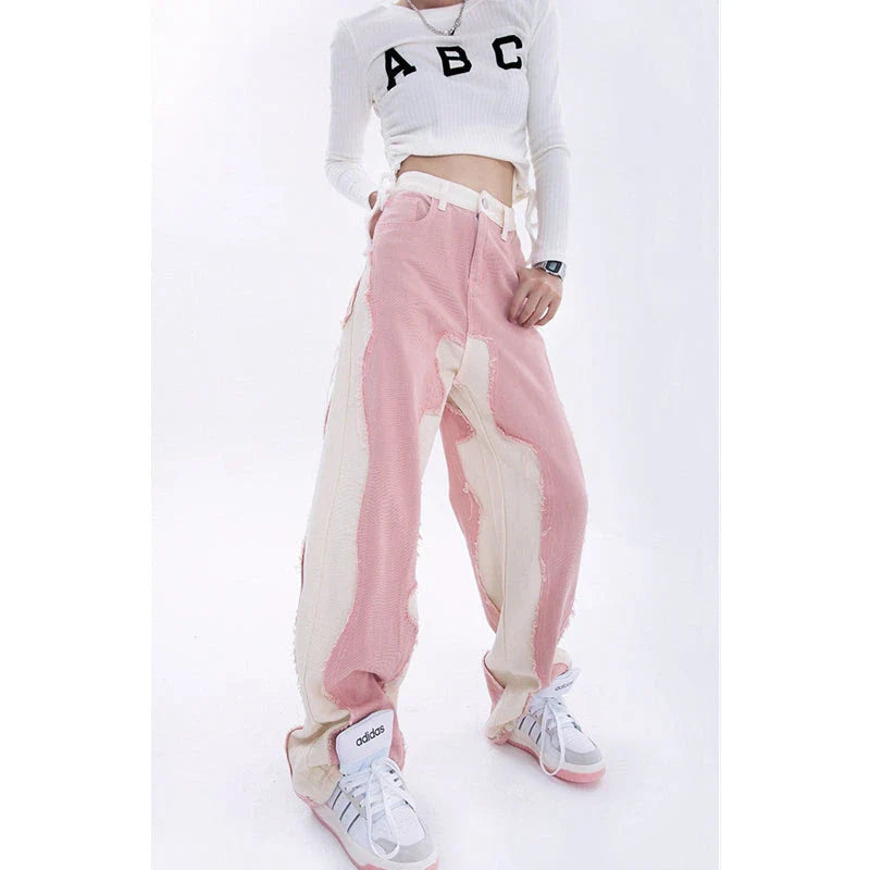 Model wearing high-waisted, wide-leg pink denim jeans with a stylish and comfortable fit