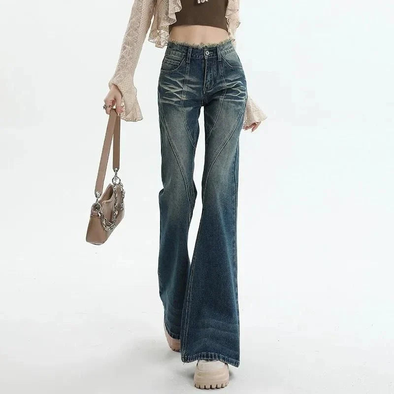 High-waisted flare jeans with a vintage wash, decorative elements, and a flattering silhouette