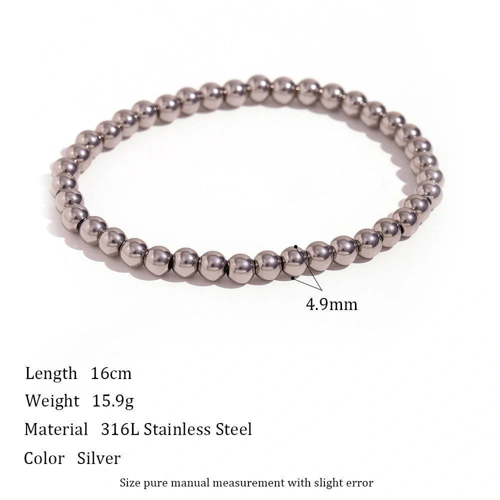 Vintage-inspired stainless steel and 18K plated elastic bead bracelet in a range of sizes and colours
