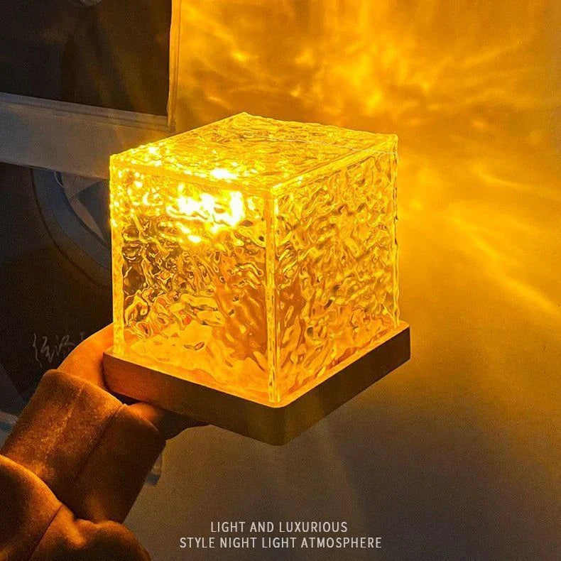 Enchanting water ripple ambient light with 16 color options, remote control, and rotatable design