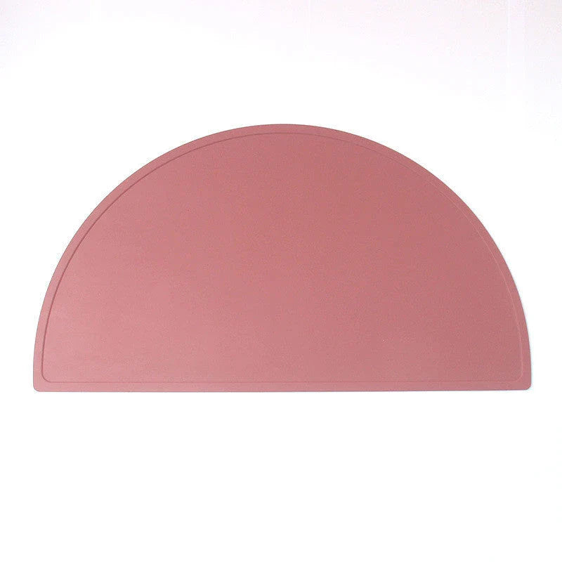 Durable silicone placemat in various colors, featuring waterproof and stain-resistant properties for easy cleaning