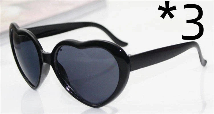Stylish heart-shaped sunglasses with unique lens design that transforms light into enchanting special effects