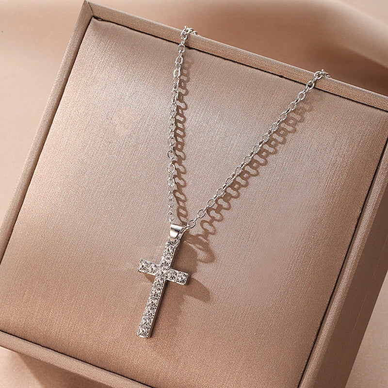 Elegant silver-toned Jesus cross pendant necklace with sparkling artificial gems, showcasing premium British craftsmanship