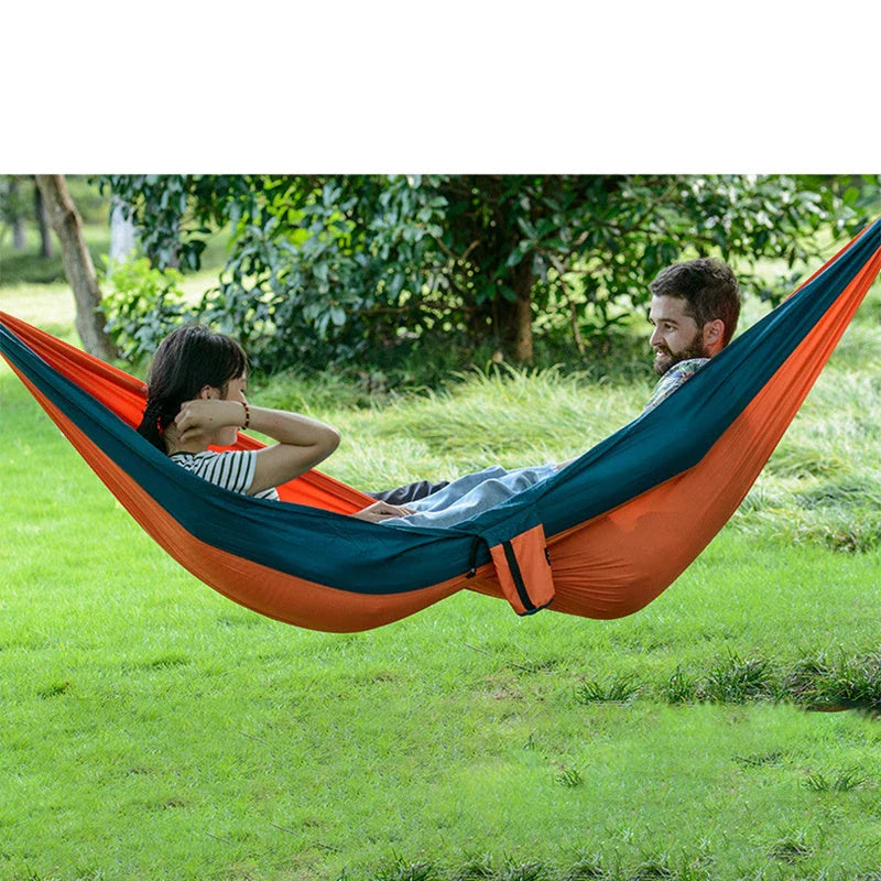 Premium double hammock for outdoor camping and hunting, made with soft, breathable fabric and reinforced climbing ropes