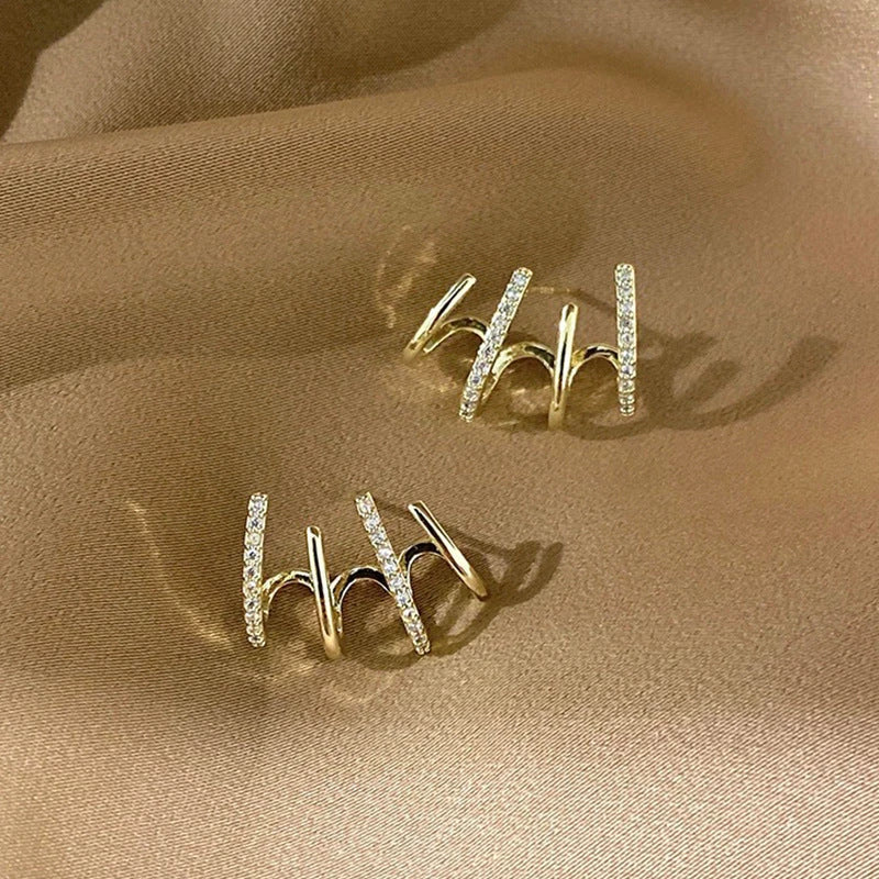 Radiant sterling silver earrings with four-prong zircon stone settings, elegant and fashionable jewelry for women