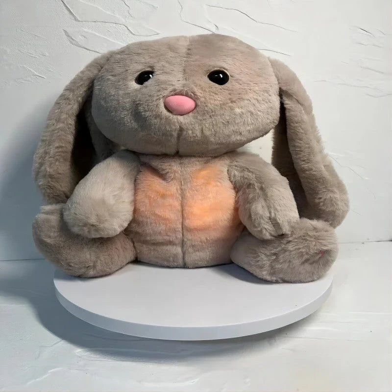 A soft, plush rabbit toy with a breathing mechanism that mimics natural respiration to soothe and comfort newborns