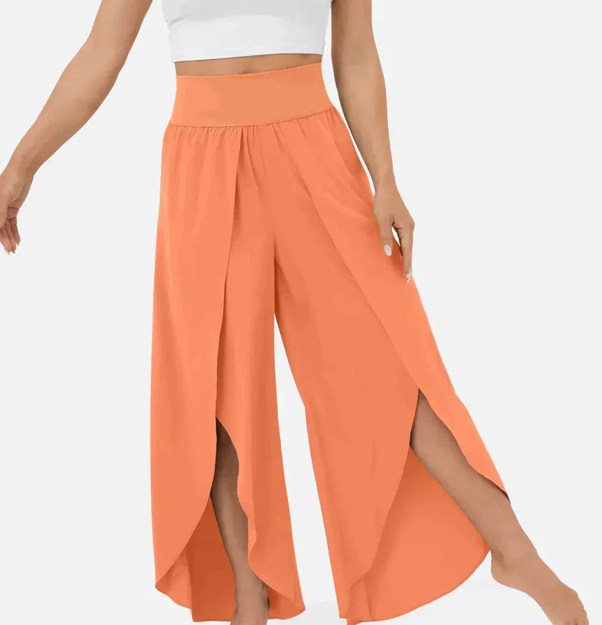 Versatile high-waist split-leg yoga trousers in a variety of colours, featuring a wide-leg silhouette and elasticated waistband for comfort and style.