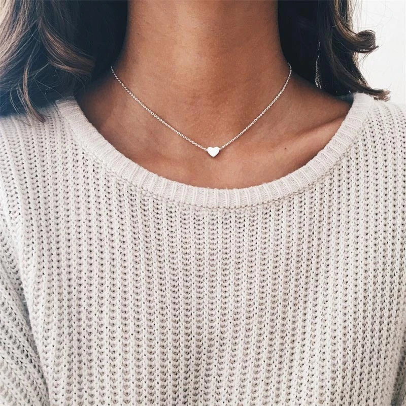 Elegant gold-tone double-sided love pendant necklace with a sleek clavicle chain design