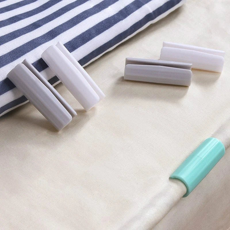 Non-slip sheet fixing clips in various colours for securing bedding and cushions