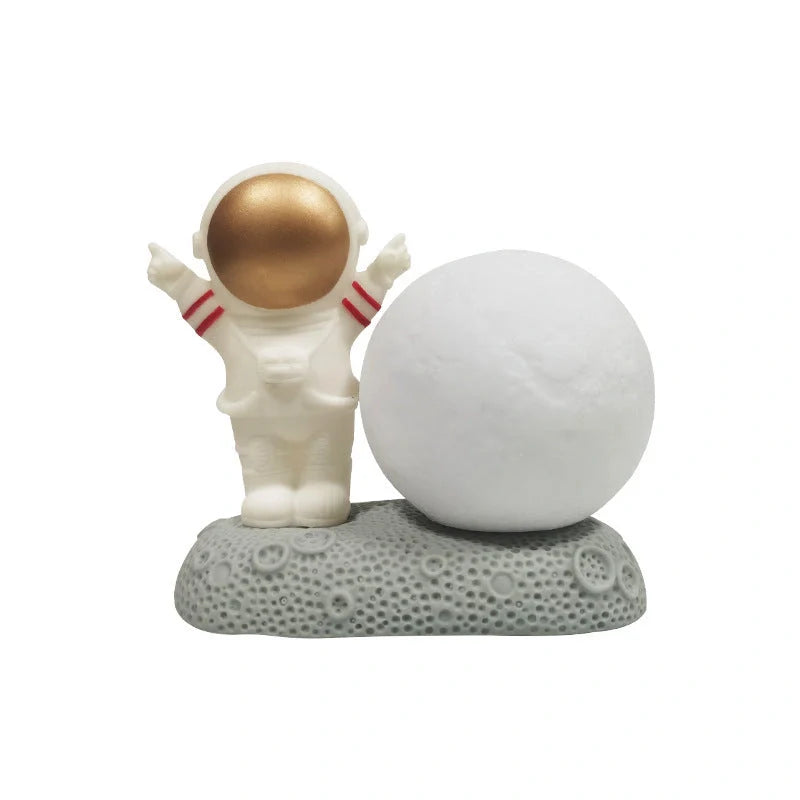 Astronaut-themed colour-changing night lamp with durable natural resin construction