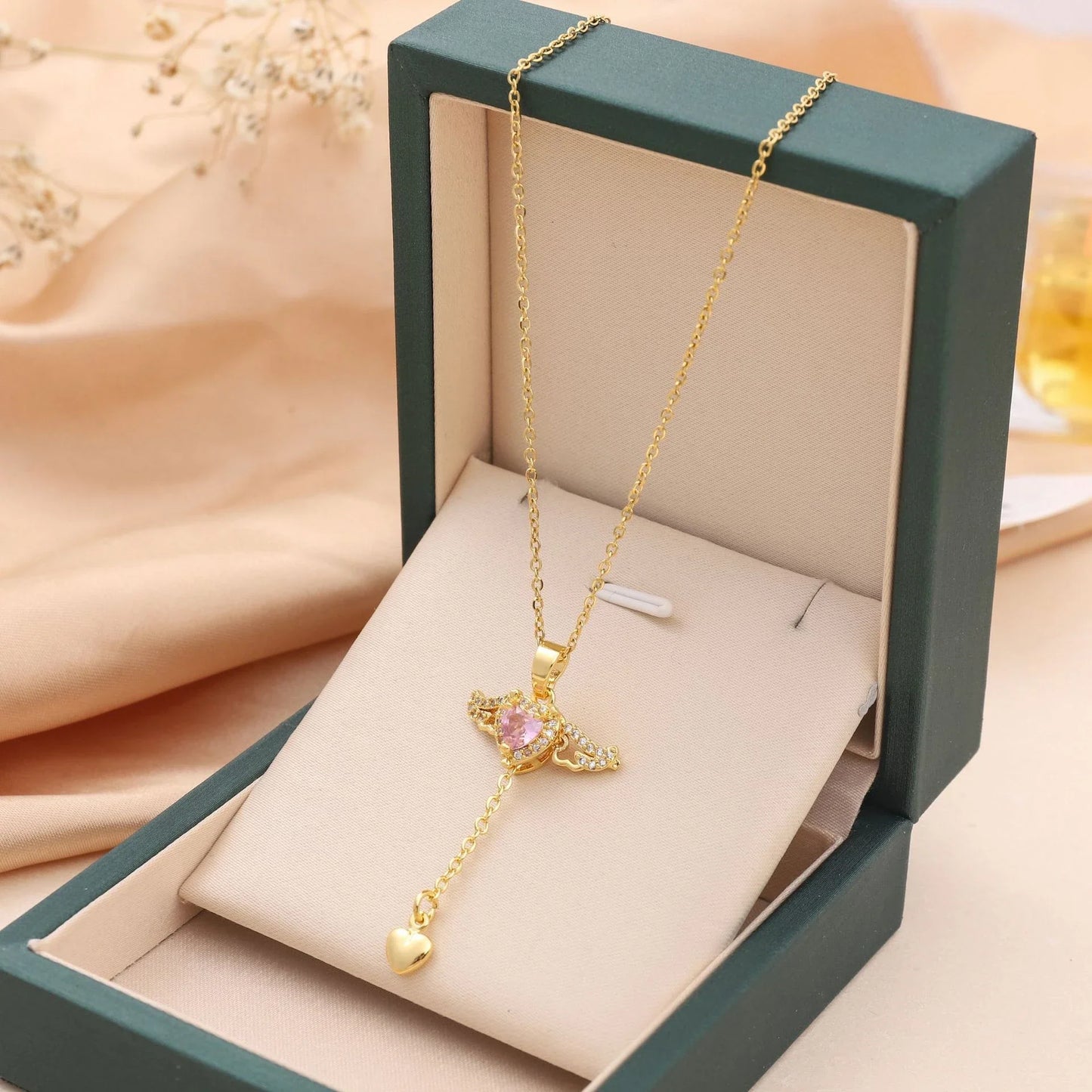 Enchanting necklace with Cupid heart and fluttering angel wings, crafted with titanium steel and sparkling zircon crystals