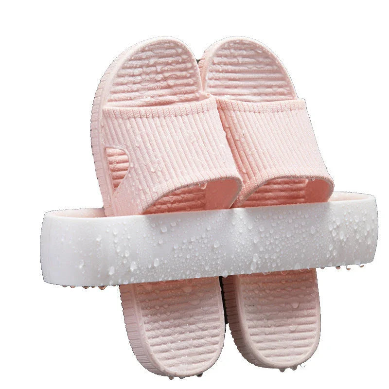Premium bathroom slippers with suction cups for secure hold, available in pink, blue, and grey colours