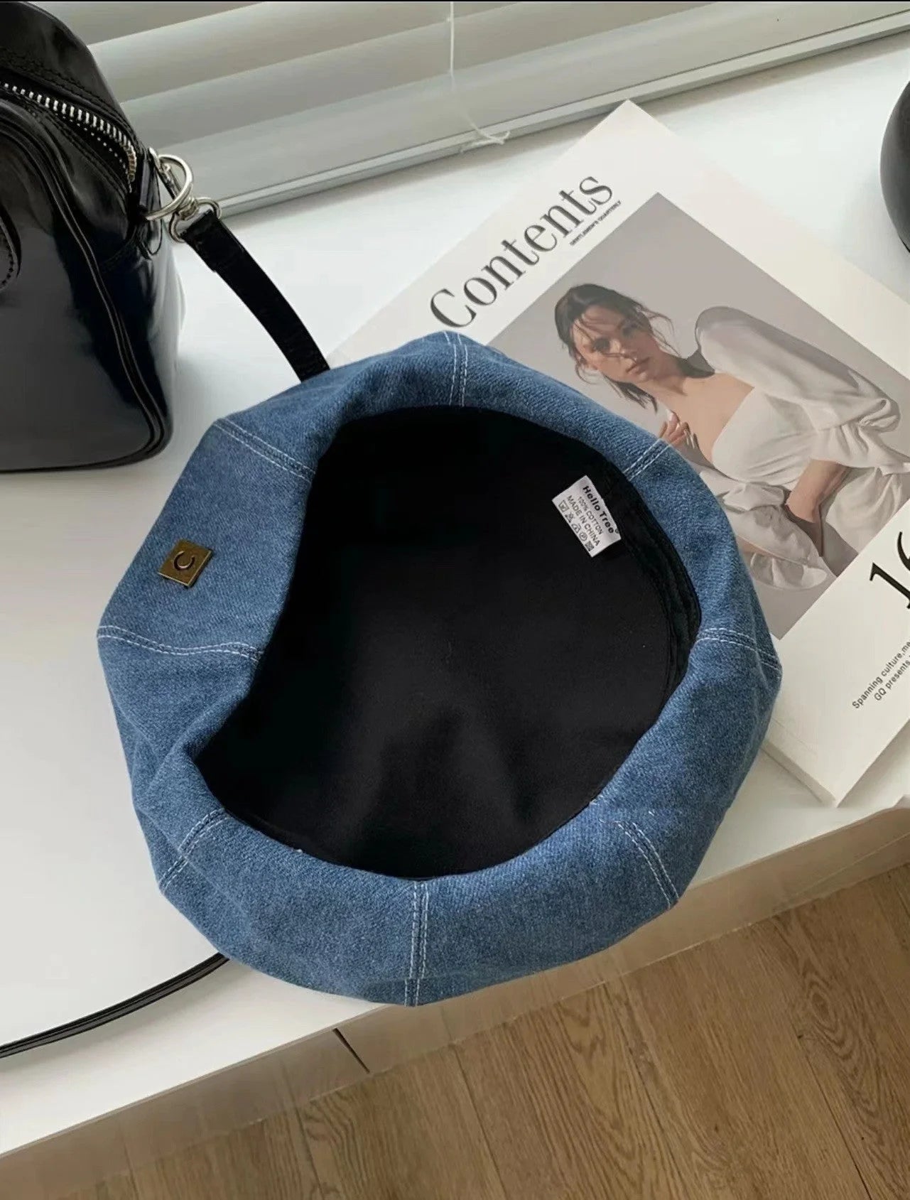 A stylish Japanese-inspired denim beret with a dome-shaped crown and a brimless silhouette, available in light, medium, and dark denim shades.