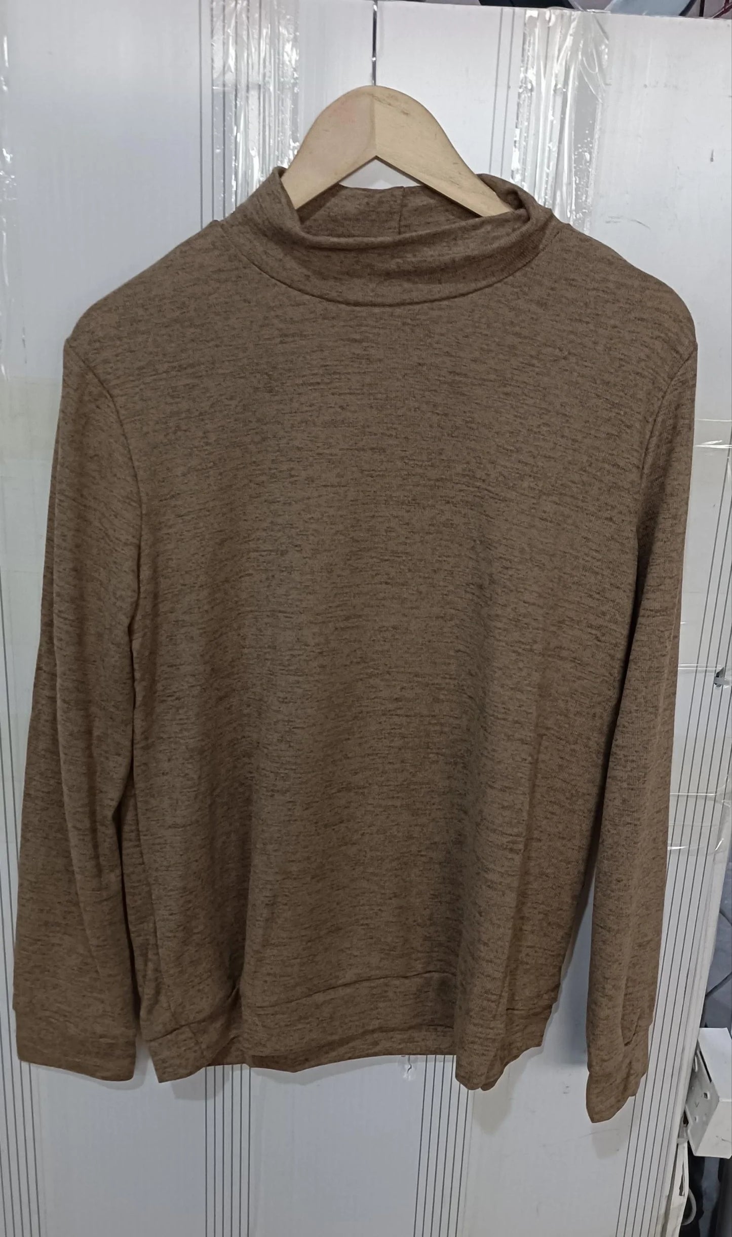 A long sleeve knitted jumper in various solid colours, including light gray, black, khaki, blue, and pink