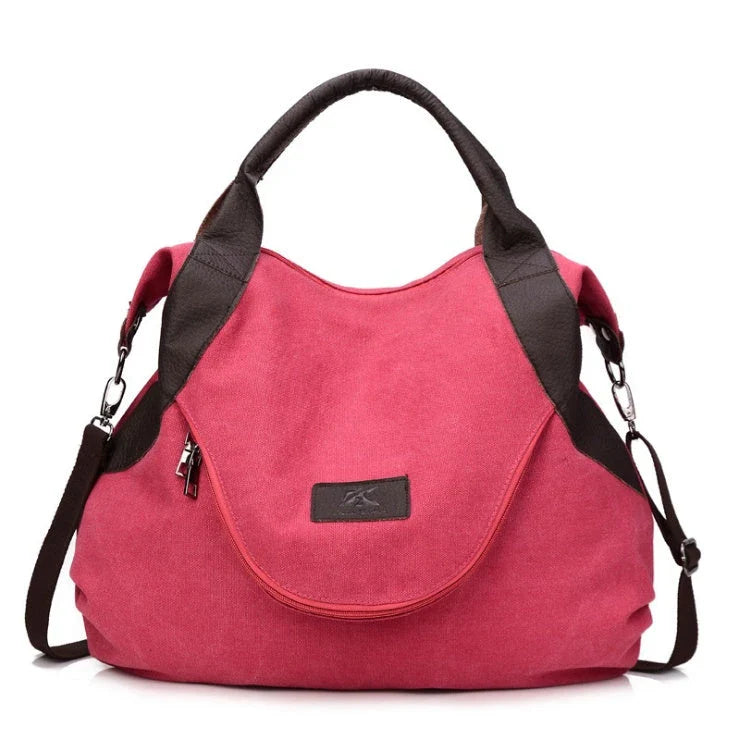 Stylish and versatile canvas shoulder bag with premium brass hardware and thoughtful interior organisation