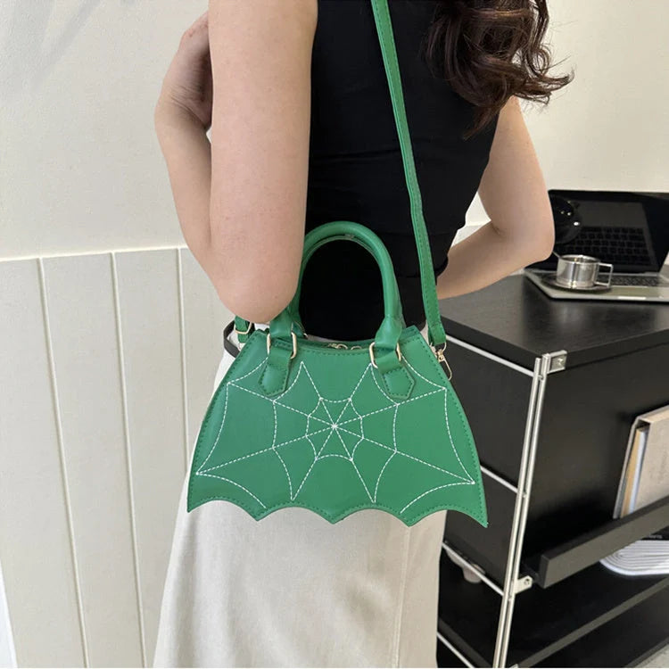 Trendy spider web-patterned shoulder bags in various colours, perfect for adding a spooky-chic touch to your Halloween outfit
