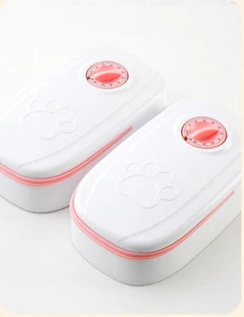 Automatic pet feeder made of durable plastic and stainless steel, designed to dispense consistent meals for cats and dogs without electricity