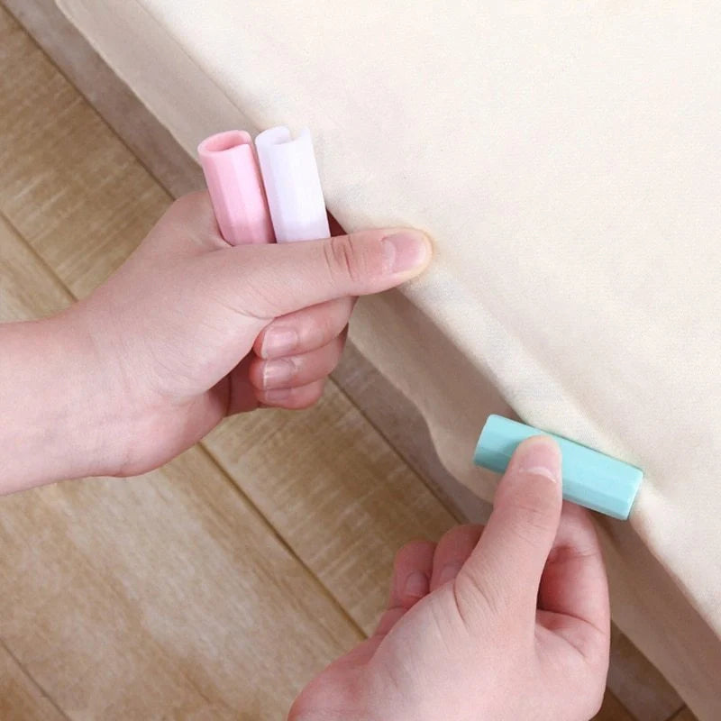 Non-slip sheet fixing clips in various colours for securing bedding and cushions